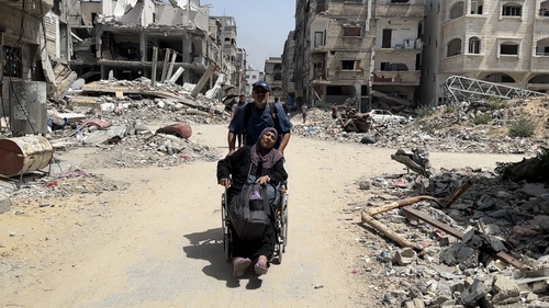 Kamal Adwan hospital's health team evacuate Palestinian patients after Israeli airstrikes damaged the hospital in Gaza