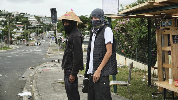 Two Independence activists man makeshift roadblocks in Noumea, France's Pacific territory of New Caledonia