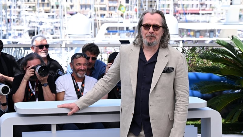 Gary Oldman attends the Parthenope photocall during the 77th Cannes Film Festival in Cannes, France