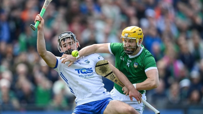 Waterford's Mark Fitzgerald (R) in against against Limerick forward Séamus Flanagan