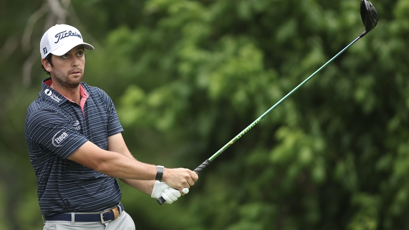 Riley cracks a drive on the sixth hole