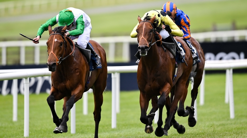 Rosallion, with Sean Levey up, right, on their way to winning the Tattersalls Irish 2,000 Guineas ahead of Haatem