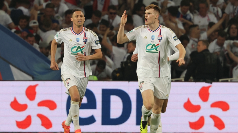 Jake O'Brien (R) celebrates after pulling a goal back for Lyon in the French Cup showpiece