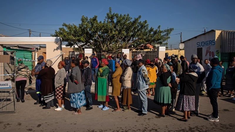 Voters queue outside a polling station in the Khayelitsha township in Cape Town