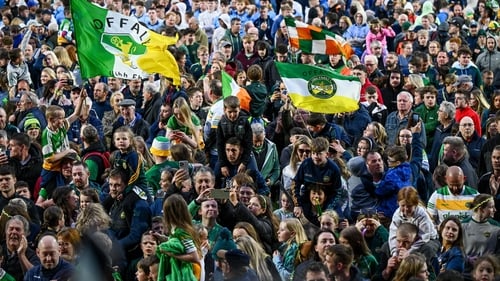 Offaly supporters on the pitch at Laois Hire O'Moore Park after the Leinster final