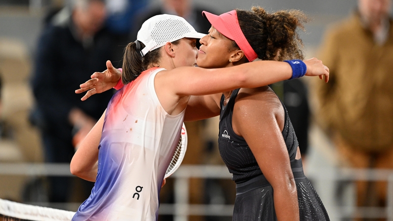 Iga Swiatek, left, and Naomi Osaka embrace after their gripping encounter at Roland Garros