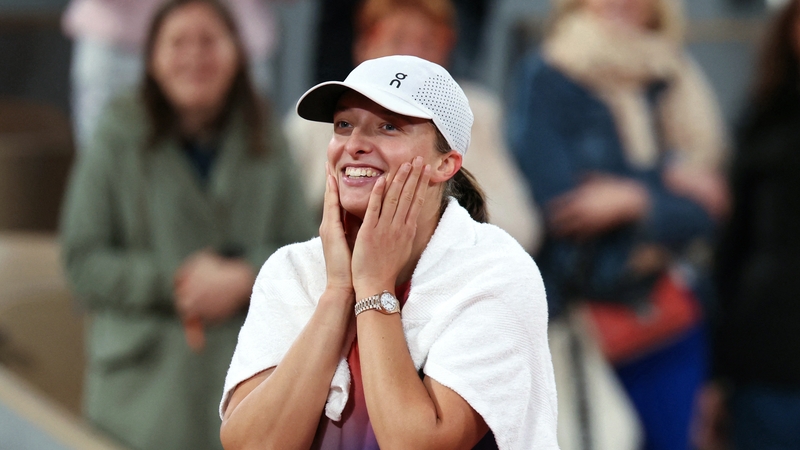 Iga Swiatek celebrates after victory over Marie Bouzkova