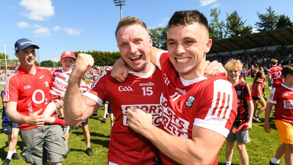 Cork players Brian Hurley, left, and Sean Powter celebrate victory over Donegal at Pairc Ui Rinn