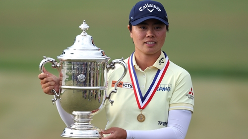 Yuka Saso poses with the trophy after turning her US Open fortunes around