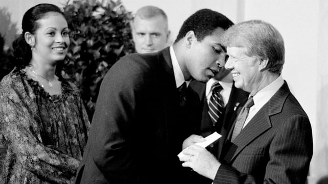 Jimmy Carter greets boxer Muhammad Ali at a White House dinner in 1977