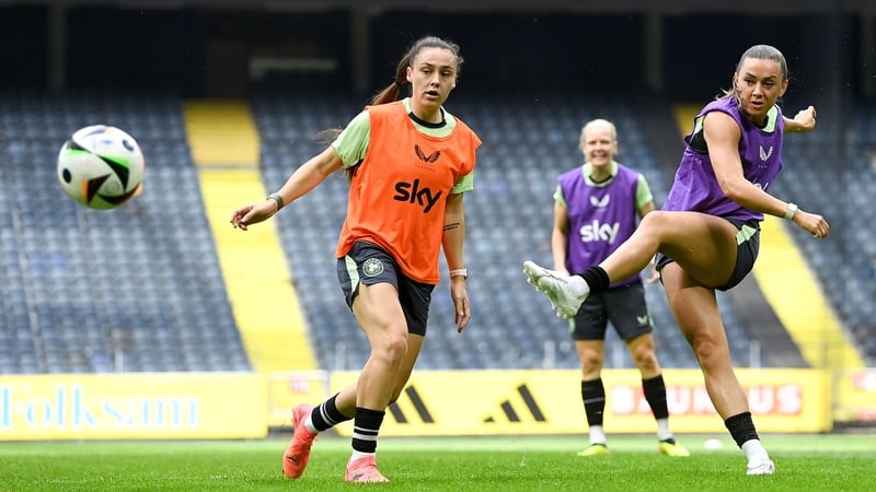 Katie McCabe in action against Jess Ziu (L) at Ireland's training session in Stockholm on Monday