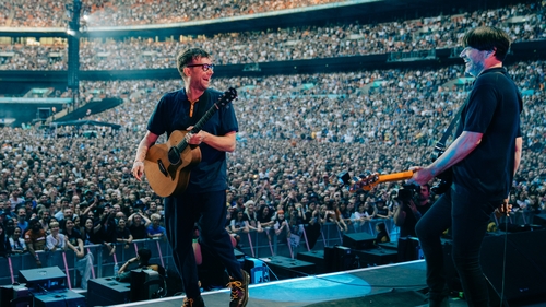 Damon Albarn and Alex James om stage at Wembley Stadium last July