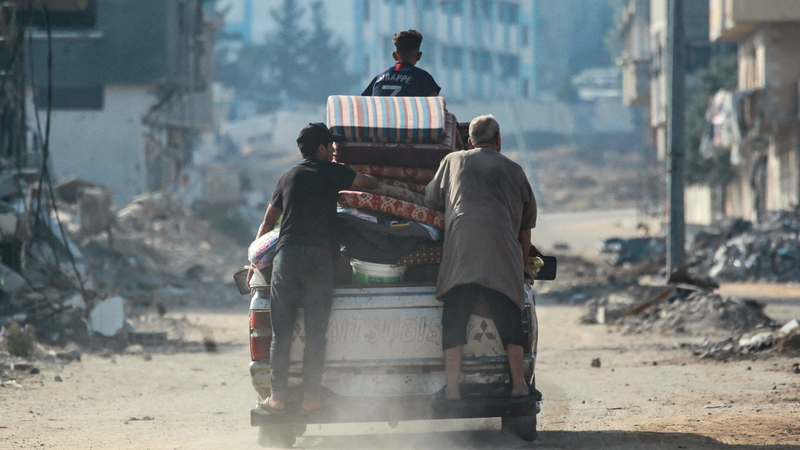 Displaced Palestinian civilians flee from the east of al-Bureij in the central Gaza Strip due to Israeli bombardment