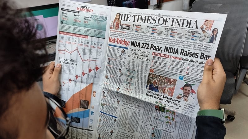 A man is reading a newspaper following the results of India's general election, in Kolkata, India, on June 5, 2024. Photo: Getty Images