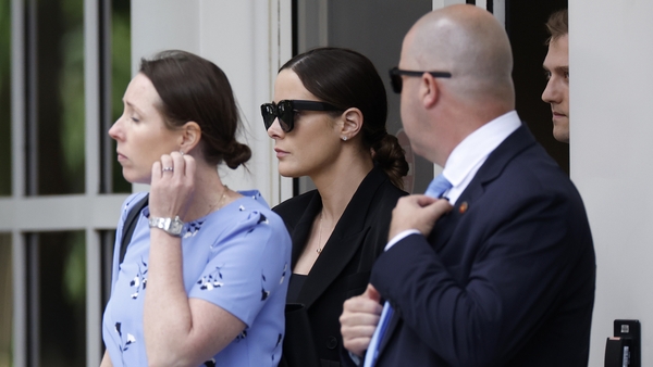 Naomi Biden (C), daughter of Hunter Biden, leaves the J. Caleb Boggs Federal Building