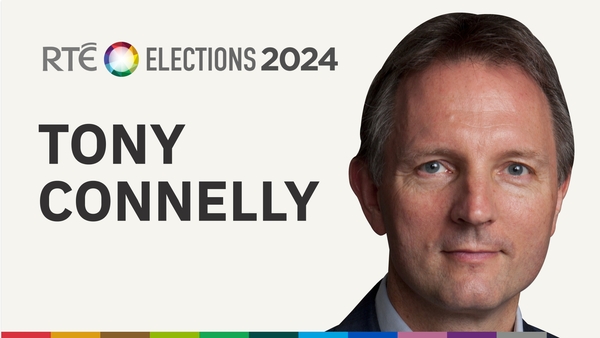 A man, who was taking part in a traditional parade, voting in Belgium yesterday