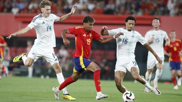 Spain starlet Lamine Yamal fights for the ball with Northern Ireland's Isaac Price and Jamal Lewis