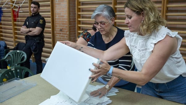 A ballot box being emptied in Madrid as vote counting got under way in the European elections in Spain