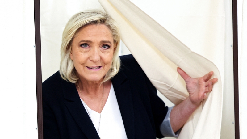 Marine Le Pen seen here voting on Sunday. Her right-wing party could lead the next parliament, the poll suggests