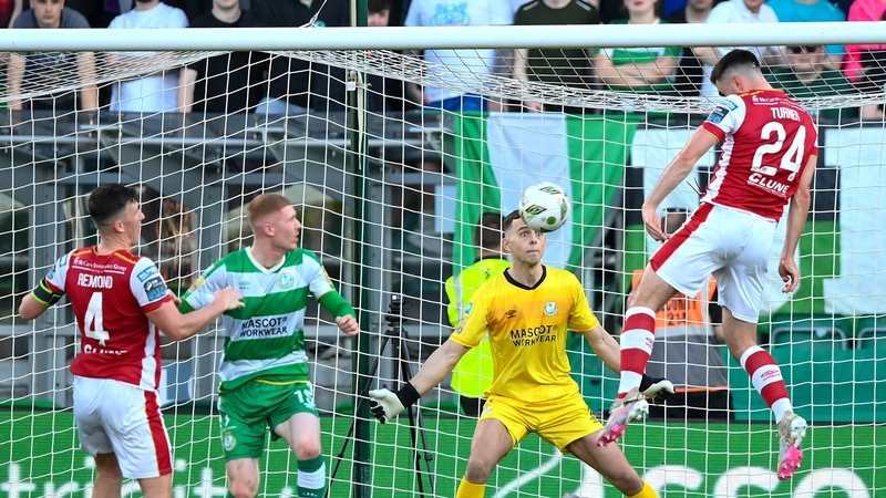 St Patrick's Athletic's Luke Turner heads his side's first goal past Shamrock Rovers goalkeeper Leon Pohls in May
