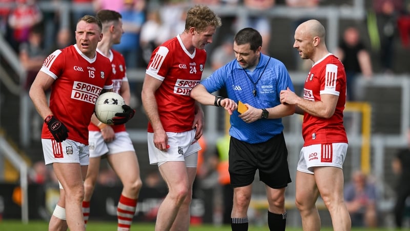 Referee Noel Mooney addresses Cork players during this year's Munster football championship