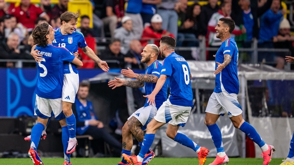 Italy match-winner Nicolo Barella is raised high by Riccardo Calafiori