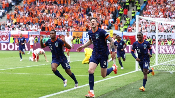 Wout Weghorst (C) wheels away in celebration after his crucial goal