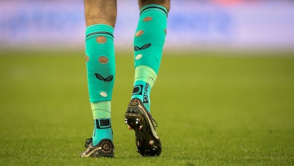Nick Pope walks on the pitch with holes in his socks during the English Premier League football match. Getty Images.
