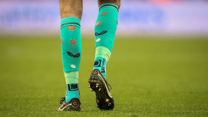 Nick Pope walks on the pitch with holes in his socks during the English Premier League football match. Getty Images.