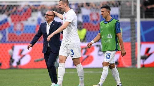 Francesco Calzona (L) celebrates with Denis Vavro (C) after Slovakia beat Belgium