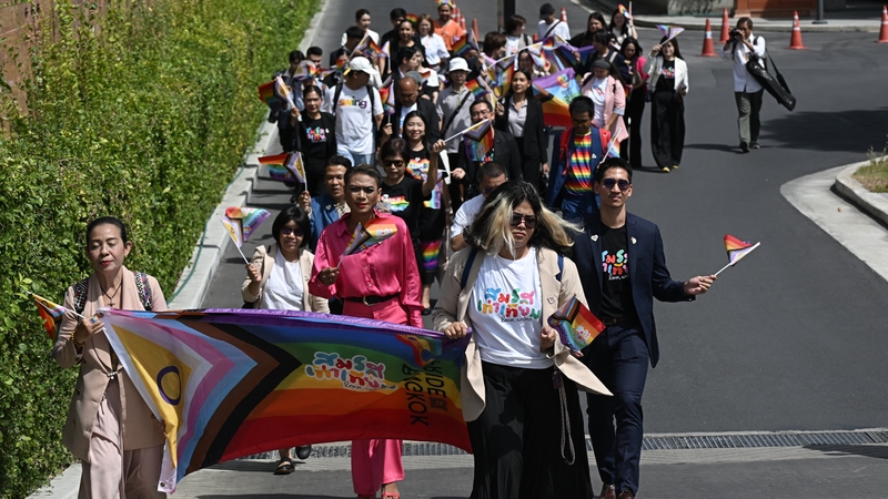 Members of the LGBTQ community arrive at Parliament ahead of the final senatorial vote on the same-sex marriage bill in Bangkok