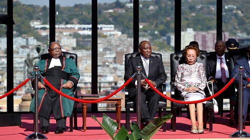 Cyril Ramaphosa (centre) will head what he calls a government of national unity with five other parties