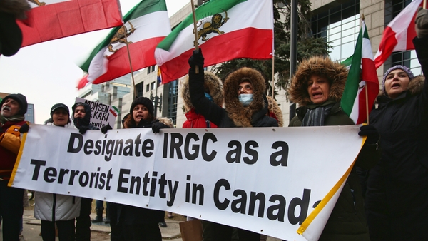 Protesters in Toronto hold a banner urging the Canada to list the Islamic Revolutionary Guard Corps as a terrorist organisation