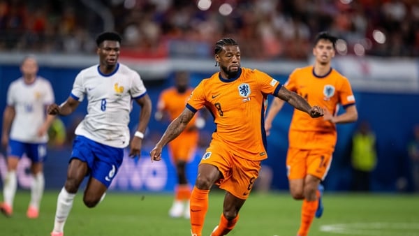 Georginio Wijnaldum is followed by Aurelien Tchouameni