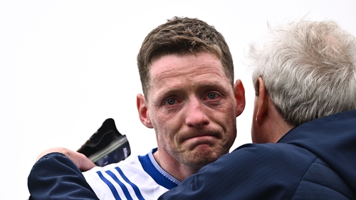 An emotional Conor McManus is consoled after the game