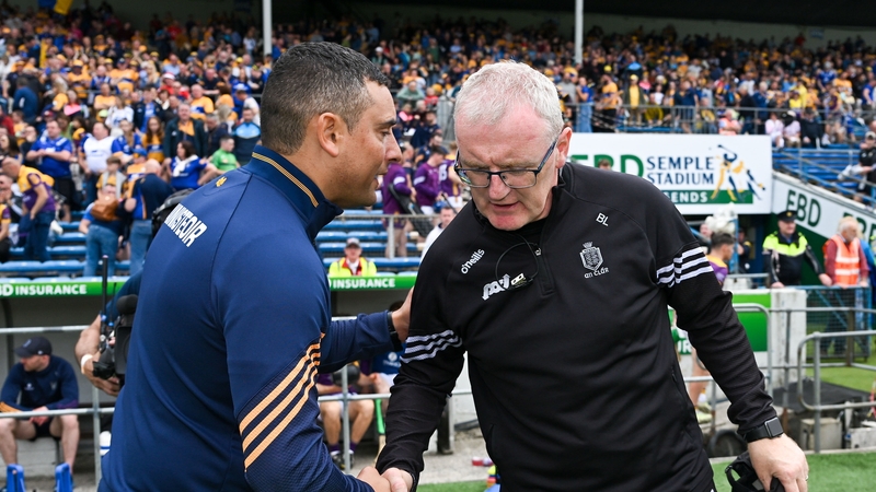 Rival managers shake hands after the Semple Stadium clash