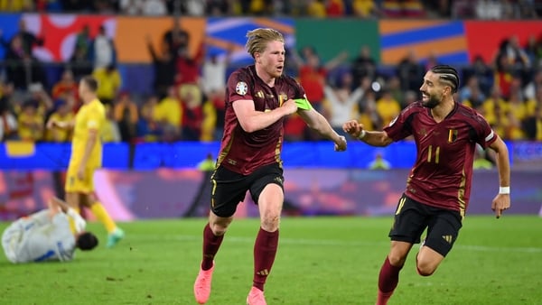 Kevin De Bruyne celebrates scoring his team's second goal with team-mate Yannick Carrasco
