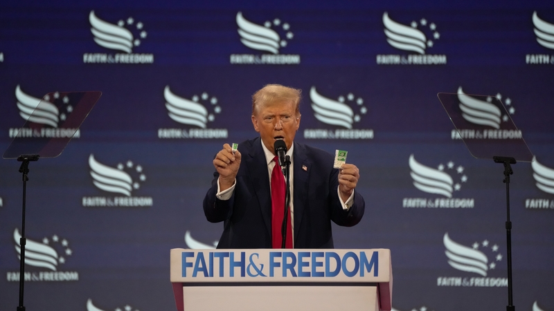 Donald Trump holds up Tic Tacs as he speaks during a meeting in Washington DC