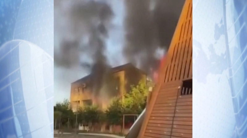Plumes of smoke rise above Derbent in Russia's North Caucasus region following a gun attack