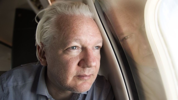Julian Assange seen on board a flight to Bangkok after his release from prison in London