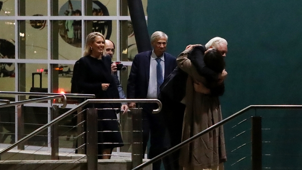 WikiLeaks founder Julian Assange embraces his wife Stella Assange as he arrives at Canberra Airport