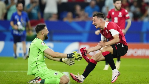 Georgia goalkeeper Giorgi Mamardashvili and team-mate Giorgi Gocholeishvili celebrate at the full-time whistle