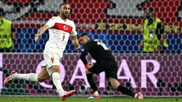Turkey's Cenk Tosun wheels away after his late goal