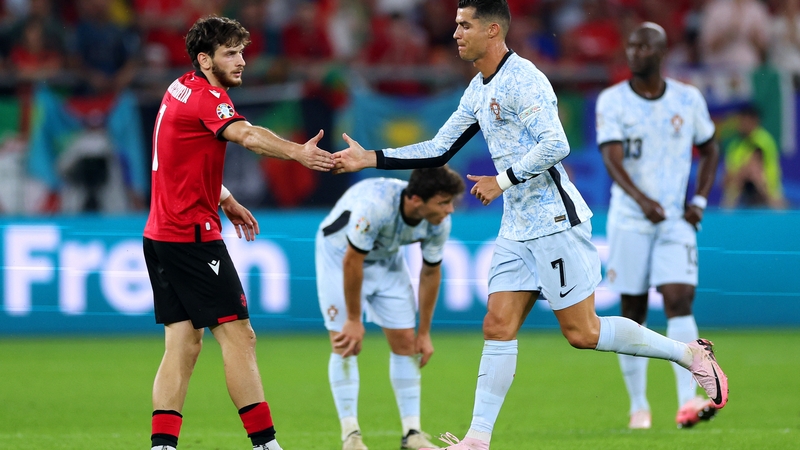 Cristiano Ronaldo shakes hands with Gerogia's Khvicha Kvaratskhelia as he is substituted off
