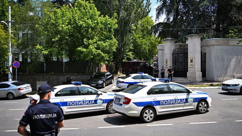Serbian police in front of the Israeli embassy in Belgrade after a man attacked an officer with a crossbow