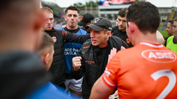Armagh manager Kieran McGeeney speaks to his players after the game
