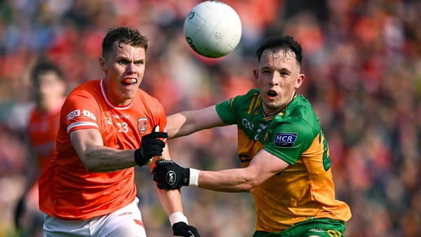 Armagh's Oisin O'Neill (L) in action against Aaron Doherty of Donegal