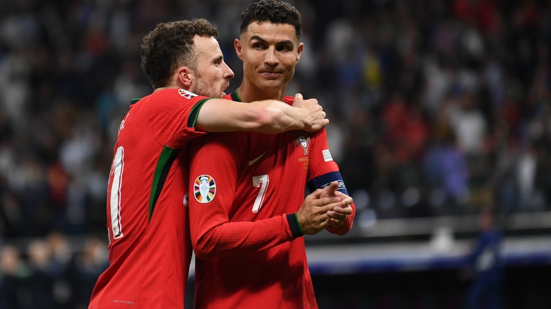 Cristiano Ronaldo and Diego Jota celebrate Portugal's shootout win