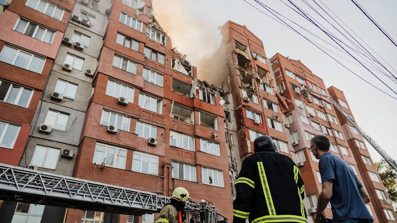 Emergency personnel are seen at the site of an apartment block in Dnipro, which was struck by a Russian missile on 28 June (Credit: Kherson Regional Military Administration of Ukraine)