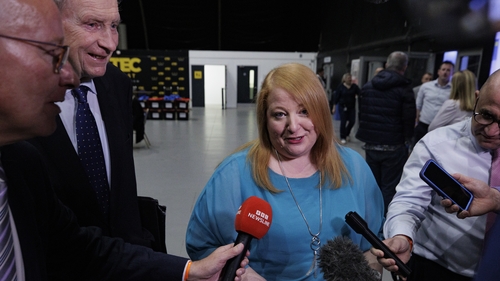 Alliance leader Naomi Long speaks to reporters at the Titanic Exhibition Centre